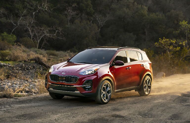 A photo of the 2020 Kia Sportag driving on a dirt road.
