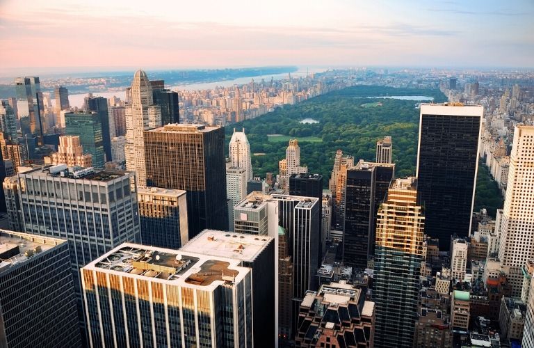 View of Central Park from behind sky scrapers