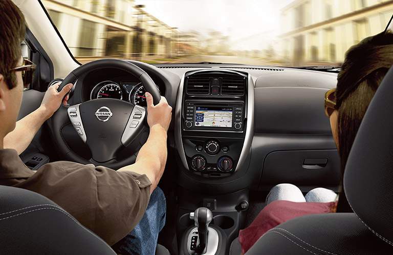 2018 Nissan Versa Sedan interior with driver and passenger