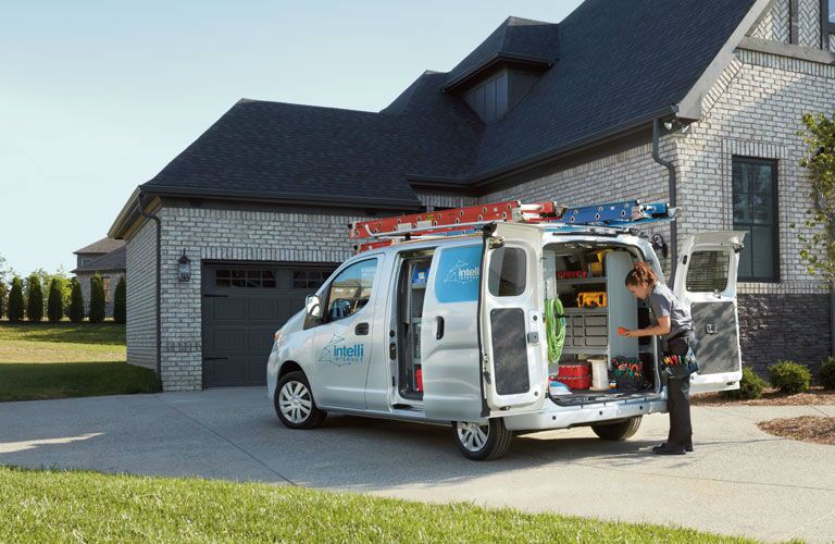 2018 Nissan NV200 Compact Cargo Van parked in driveway