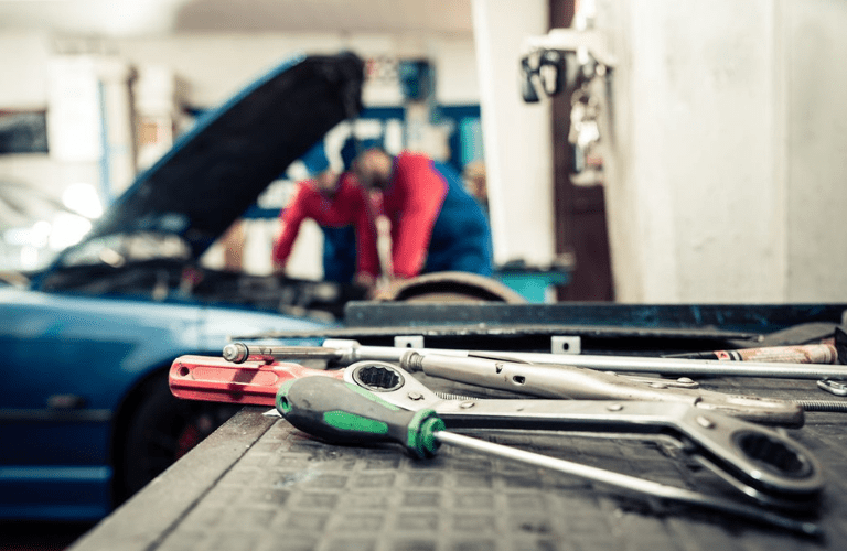 Close up of tools while mechanic repairs the vehicle