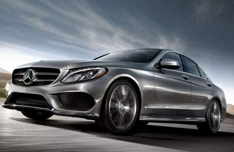side view of a silver 2018 Mercedes-Benz C 300 on the road