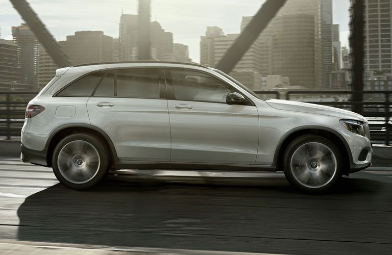 white 2018 Mercedes-Benz GLC SUV crossing a city bridge