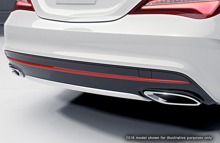 rear bumper and exhaust pipes of white 2019 mercedes-benz cla