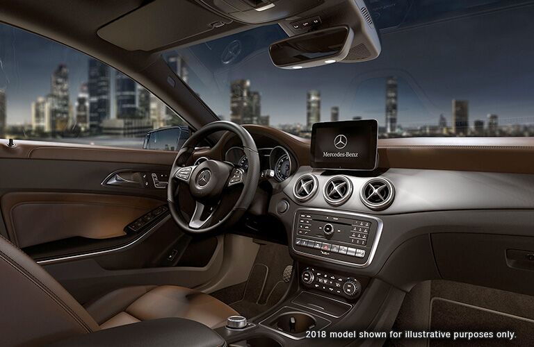 front interior of 2019 mercedes-benz cla including steering wheel and infotainment system