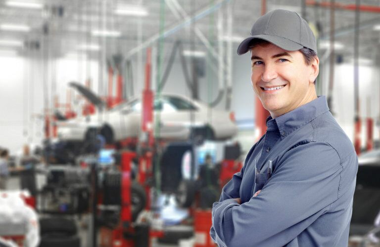 confident service technician ready to get your car back on the road