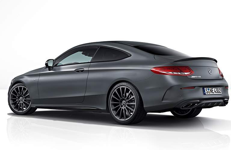 Back view of a 2018 Mercedes-AMG C43 parked in a white background.