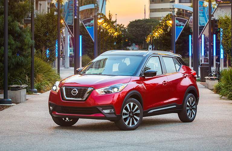 2018 nissan kicks in red parked in front of parade