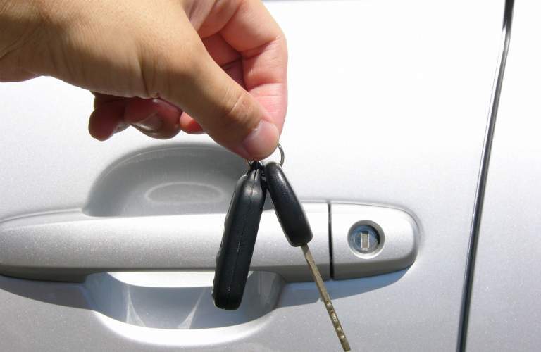 Person Handing Over the Keys to Their Old Car