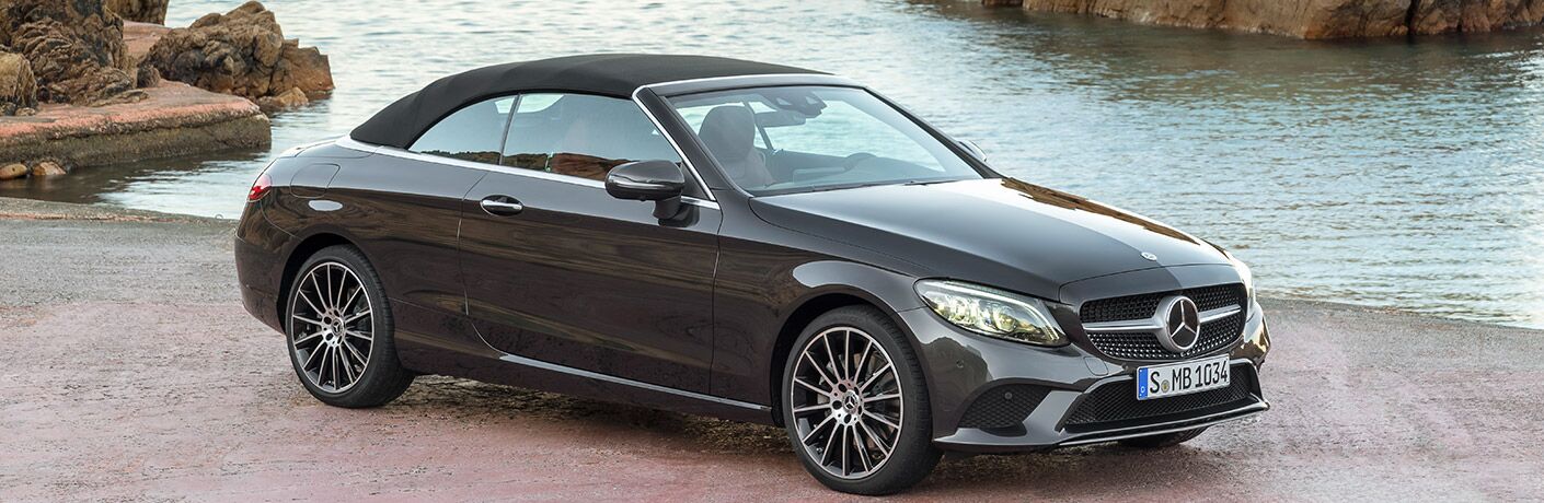 2019 Mercedes-Benz C-Class Cabriolet with the top up in front of water