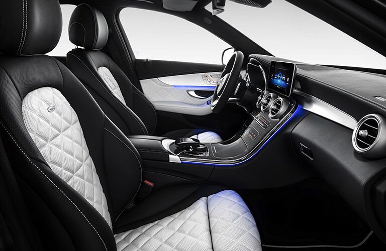 luxurious front seats of the 2019 Mercedes-Benz C-Class Sedan with blue ambient lighting