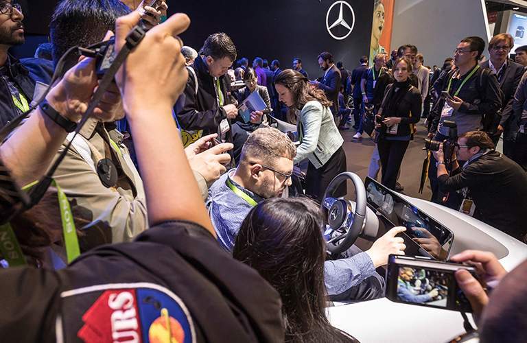 journalists exploring the new Mercedes-Benz User Experience Infotainment System