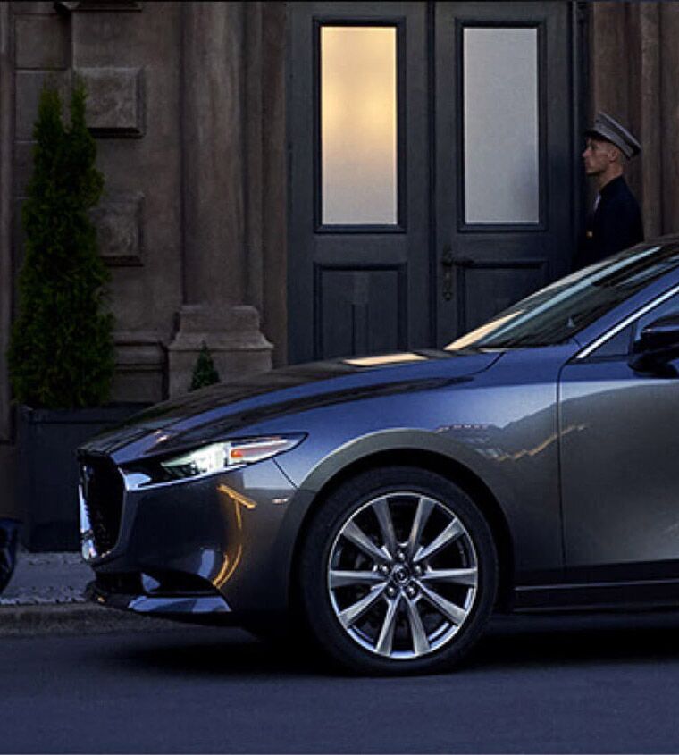 2019 Mazda3 parked in front of a building on a city street