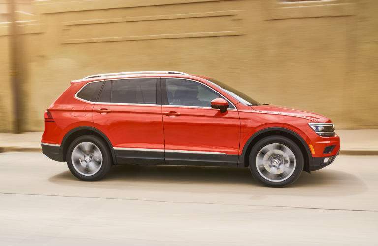 A right profile photo of a 2018 VW Tiguan in motion on the road