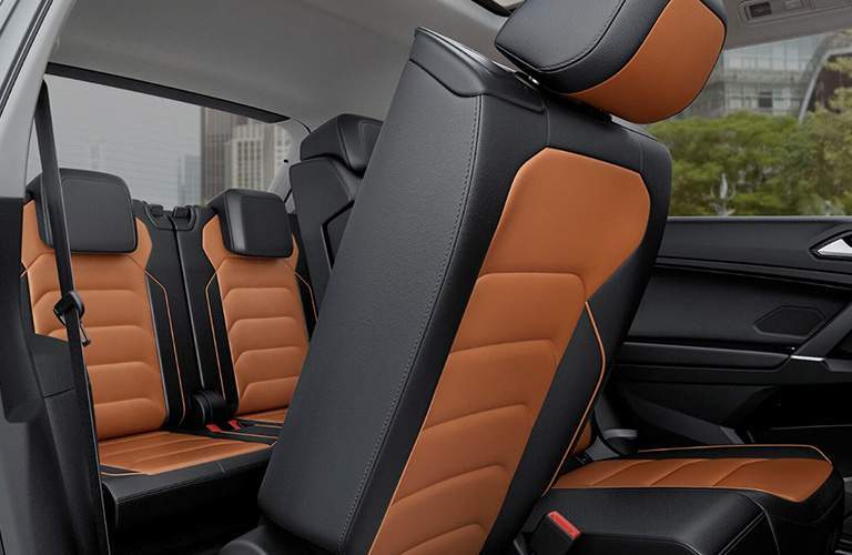 An interior photo of the 2018 Tiguan showing how passengers can get to the third-row of seats