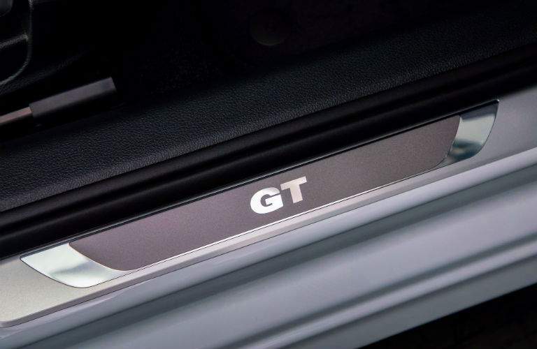A close up photo of the GT door sill badge in the Passat GT