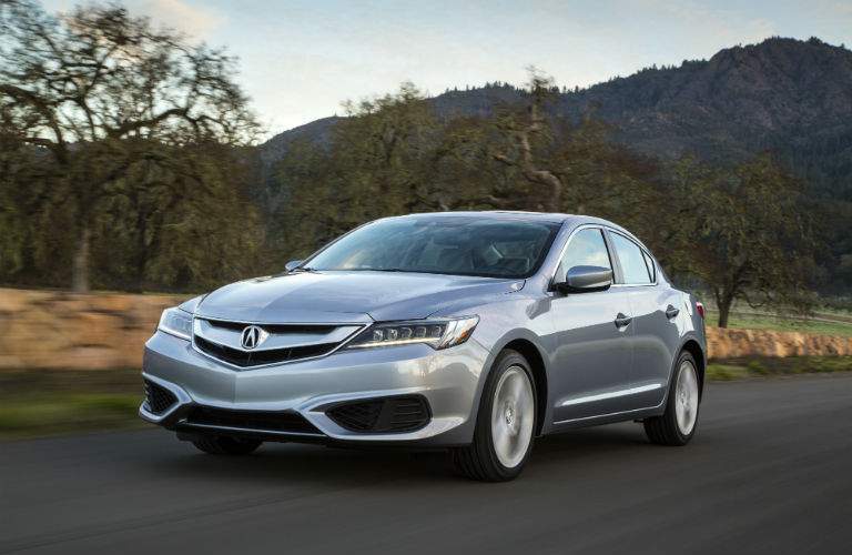 Front quarter view of the 2018 Acura ILX in white on an isolated country road