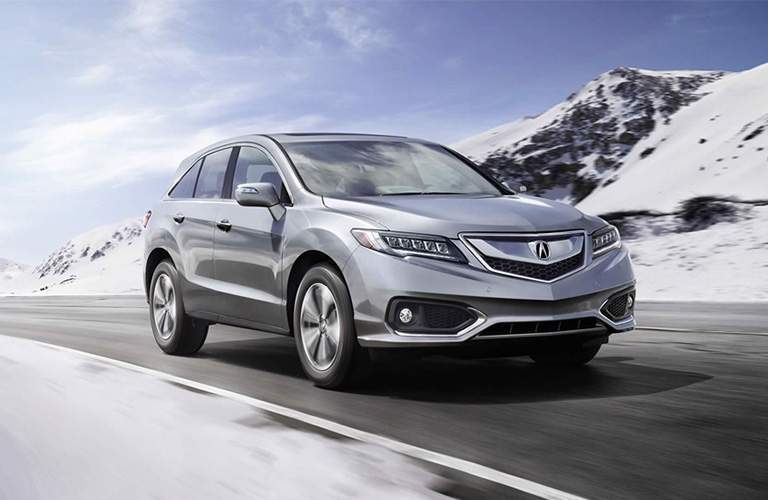 A front right quarter view of the 2018 Acura RDX on a mountain road.
