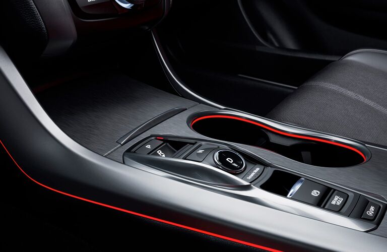 A close up photo of the center console features in the 2018 Acura TLX.