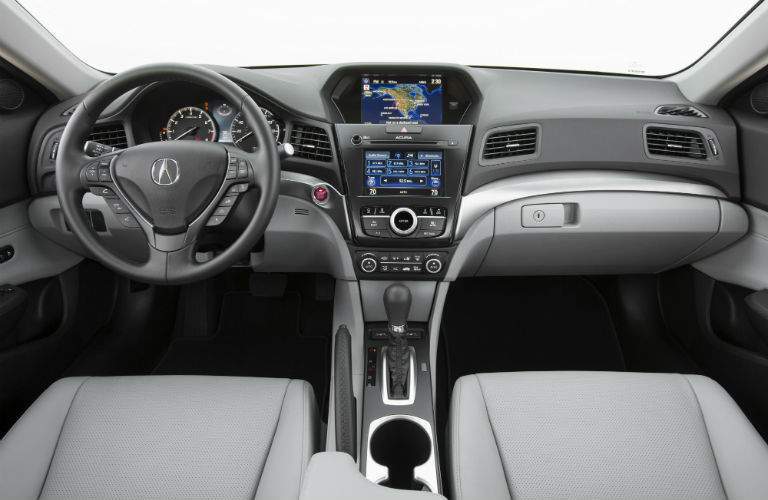 An interior photo of the 2018 Acura ILX showing the dashboard and infotainment screens