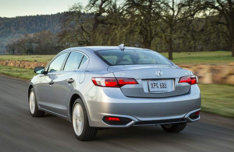 A rear quarter view a gray 2018 Acura ILX