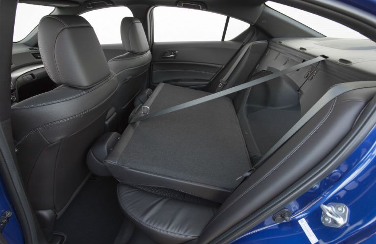 A photo of the folding rear seat and trunk pass-through hole in the 2018 Acura ILX.