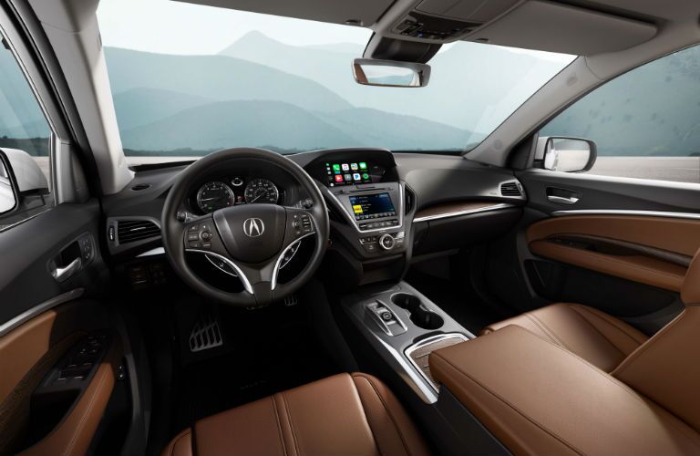 An interior photo of the front portion of the 2018 MDX Sport Hybrid showing the infotainment system.