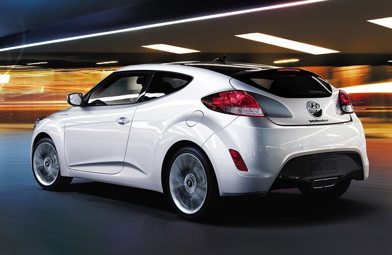 White 2016 Hyundai Veloster driving at night