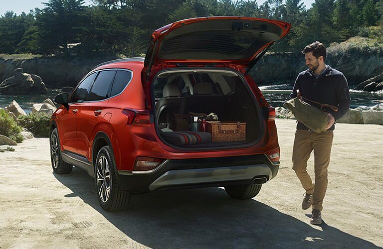 A photo of someone loading cargo into the 2019 Santa Fe XL.