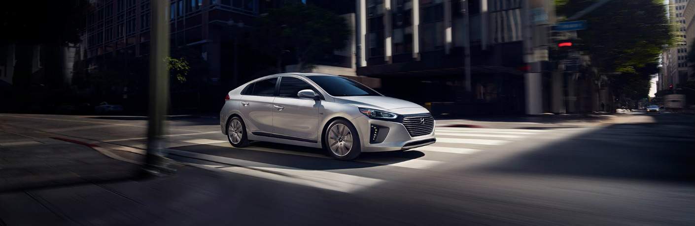 silver 2018 Hyundai Ioniq driving through city