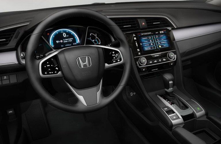 steering wheel and dashboard view of the 2017 Honda Civic Touring