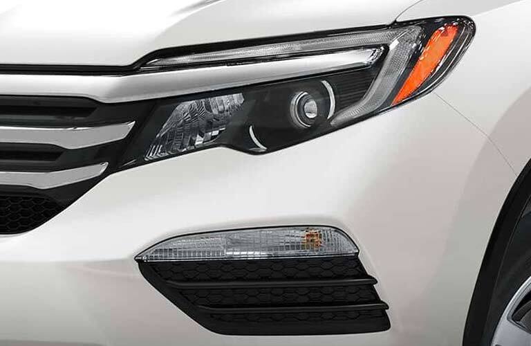 headlight close-up of the 2017 Honda Pilot LX