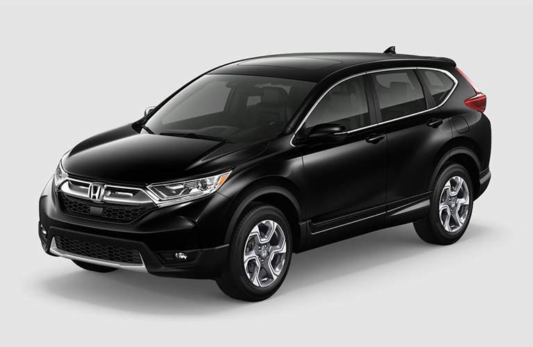 side front view of a black 2018 Honda CR-V EX-L on a gray background