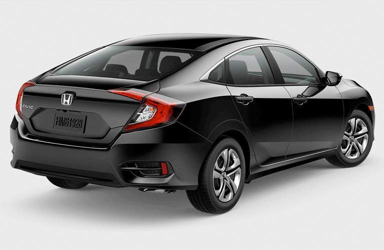 rear and side view of a black 2018 Honda Civic LX Sedan on a gray background