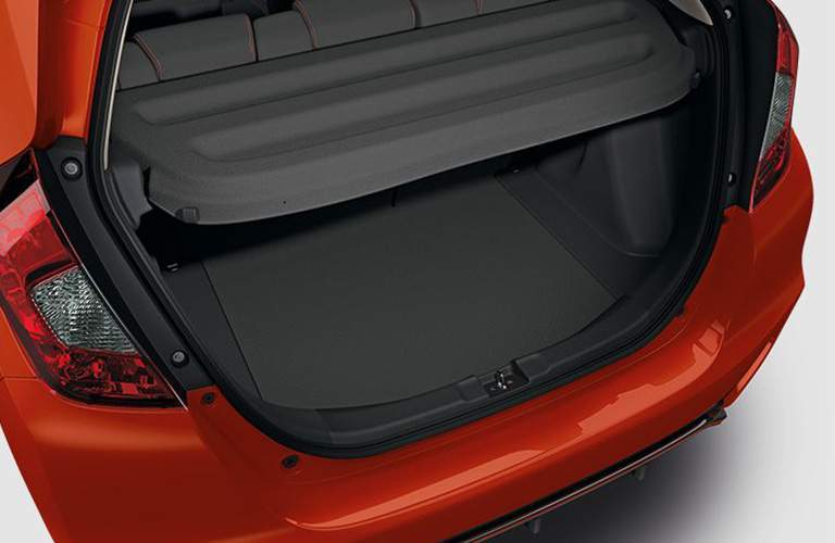 rear cargo area of a red 2018 Honda Fit