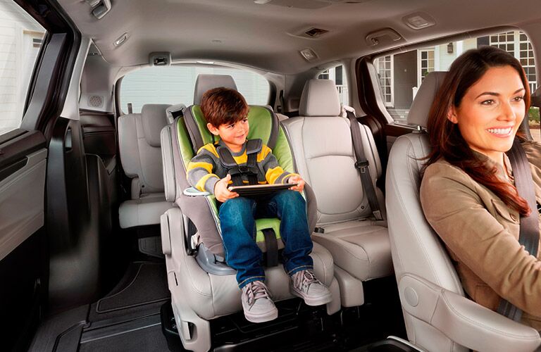 child in the second row Magic Slide seat of the 2018 Honda Odyssey 