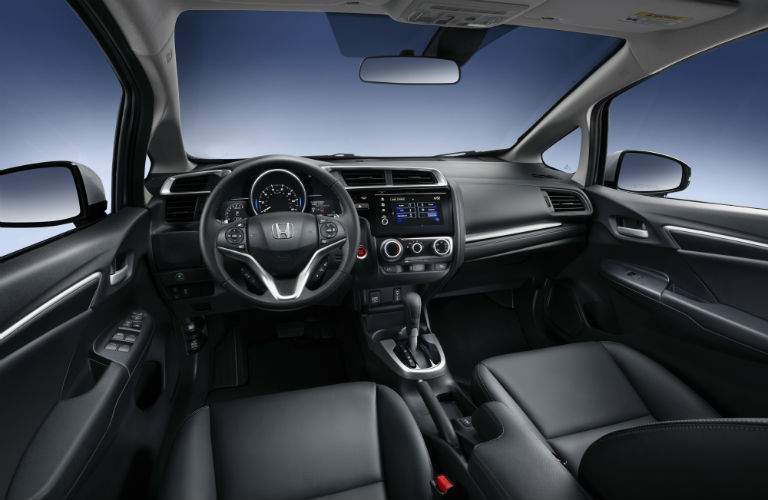 steering wheel, front seats and dashboard of the 2018 Honda Fit