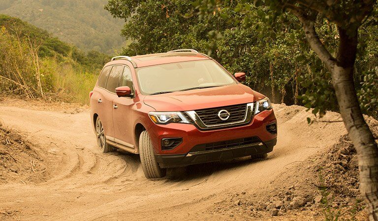 red 2017 Nissan Pathfinder covered in dirt
