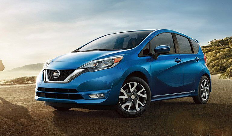 blue 2017 Nissan Versa Note parked on beach