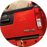 closeup of taillight on red 2017 Nissan Frontier