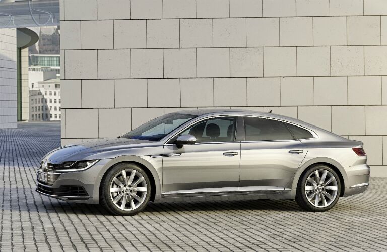 silver Volkswagen Arteon on bricked road