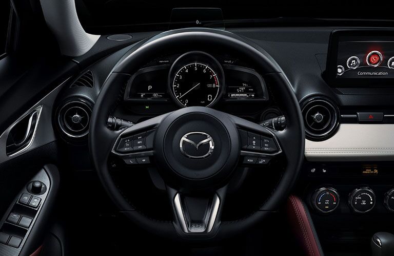 An interior photo of the driver's cockpit in the 2018 Mazda CX-3.