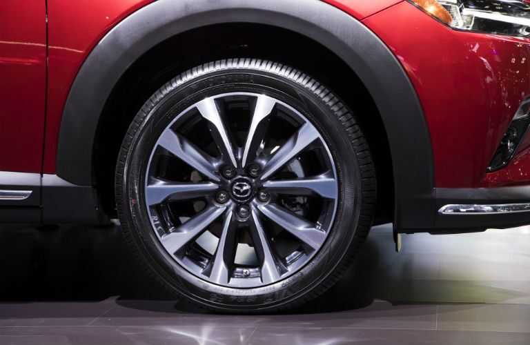 A close up photo of one of the wheel designs available with the 2019 Mazda CX-3.