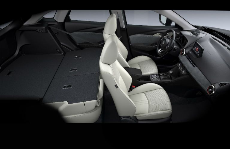 An interior photo of the rear seats folded down for max cargo capacity in the 2019 CX-3.