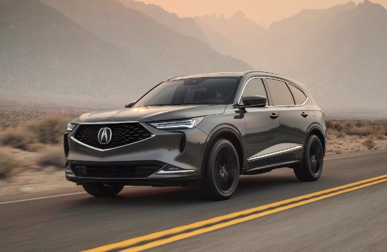 Front driver angle of a grey 2022 Acura MDX