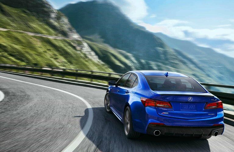 2018 Acura TLX Rear End Blue driving around curve