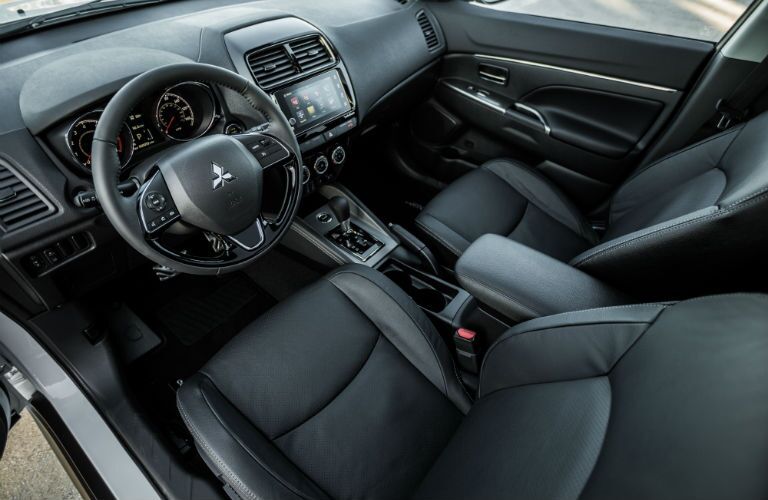 An interior photo showing the driver's cockpit in the 2018 Mitsubishi Outlander Sport.