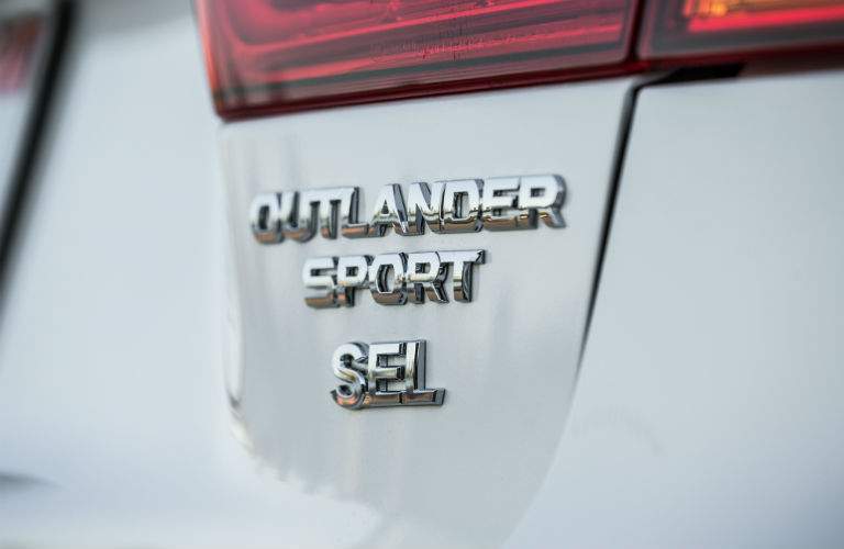 A close up photo of the Outlander Sport badge on the 2018 Outlander Sport.