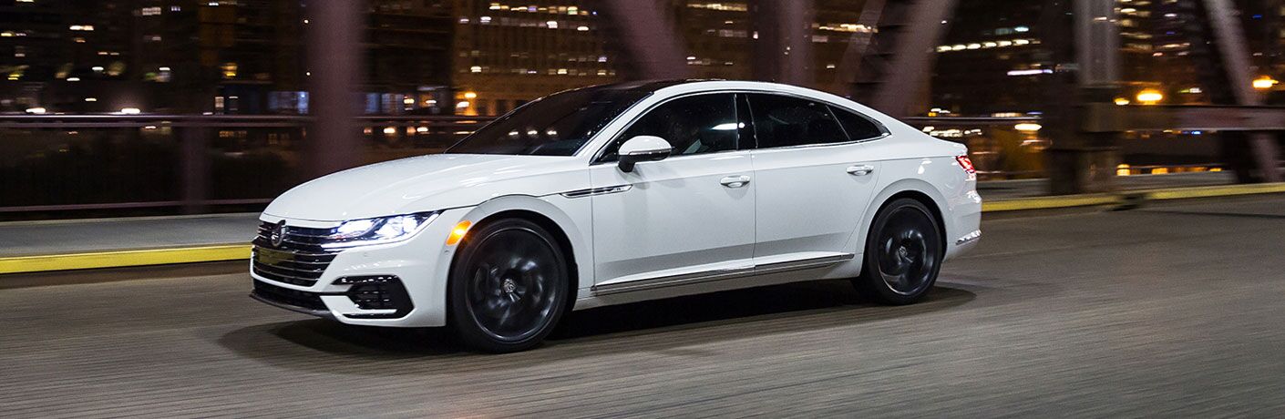2020 VW Arteon exterior front fascia driver side going fast on city highway at night