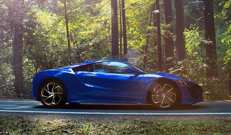2017 Acura NSX parked in front of trees